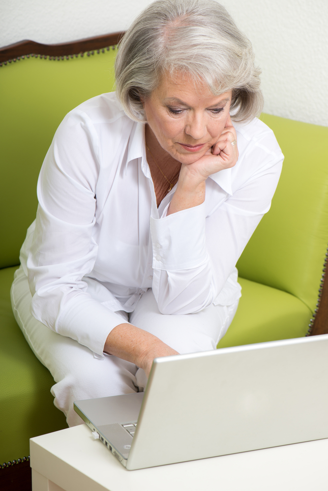 Mature woman at computer.jpg